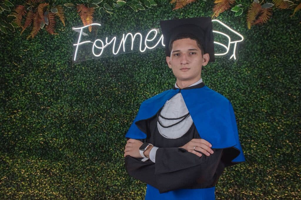 Students in a library, positioned below the FAQ section